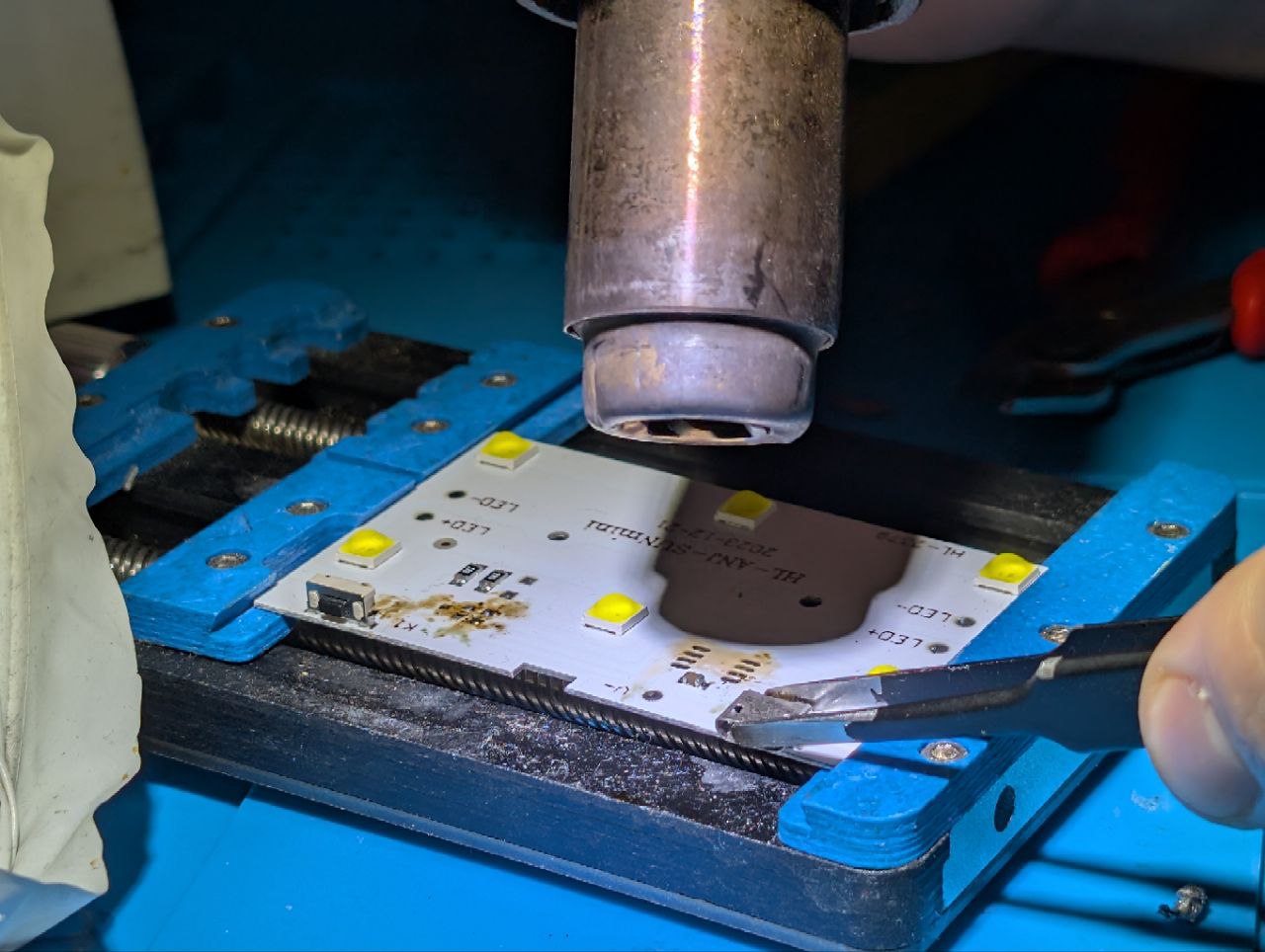 Here should be an image of me using a hot air to remove parts from the PCB